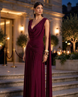 Amelisse burgundy cowl maxi dress worn at an evening gala