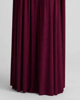 Close-up of the floor-length draped hem
