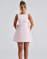 Carrie blush pearl bow mini dress, front studio view