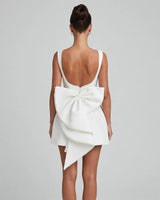 Carrie ivory pearl bow backless mini dress, studio back view