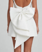 Oversized pearl-edged back bow detail