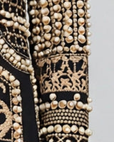 Pearl-embellished sleeve detail