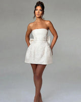 Elenora Jacquard Bow Strapless Mini Dress in ivory, front studio view