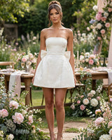 Elenora ivory jacquard mini dress worn at a garden party