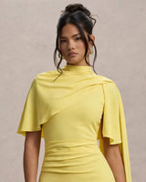 Close-up of the asymmetric twisted cape drape