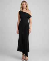 Aria black asymmetric shoulder pleated midi dress — studio front