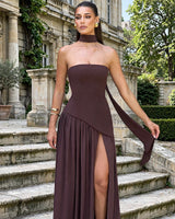Maliyah plum brown maxi dress worn on stone steps