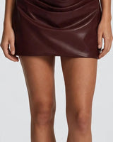 Draped cowl overlay skirt detail