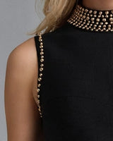 Close-up of the gold bead armhole trim