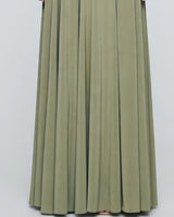 Flowing pleated chiffon skirt detail in sage