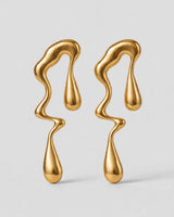Rhea gold molten drop earrings — studio pair