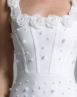 Close-up of boned corset bodice with scattered pearls