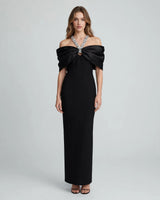 Sloane black crystal-bow off-shoulder maxi dress — studio front