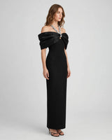 Sloane black crystal-bow off-shoulder maxi dress — studio side view