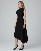 Odette black asymmetric high-neck brooch maxi dress — studio side view
