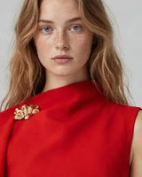 Gold shoulder brooch detail