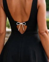 Pearl bow open back detail