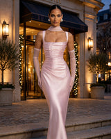 Calanthe blush satin maxi dress worn at a hotel entrance in the evening