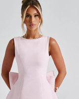 Pearl-trimmed boat neckline detail