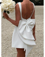 Carrie ivory mini dress, supplier back view with pearl bow
