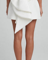 Pearl-edged bow tails detail
