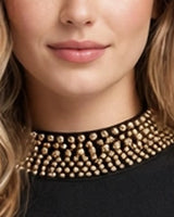Close-up of the gold beaded mock collar