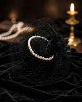 Faye black pearl feather veil fascinator — on velvet