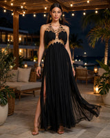 Freya gold-ring halter maxi dress worn on a resort terrace at night