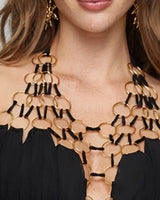Close-up of the gold ring halter neckpiece