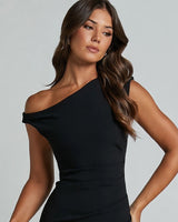 Close-up of the asymmetric draped off shoulder neckline