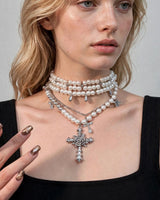 Juliet layered pearl cross necklace — worn close-up