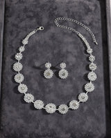 Lucia diamante halo necklace and earring set — on velvet