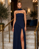 Maliyah navy maxi dress worn on a marble staircase at an evening event