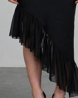 Close-up of asymmetric chiffon flounce hem