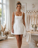 Orla ivory mini dress worn in a bridal boutique