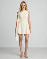 Rhea ivory one-shoulder knot-sash mini dress — studio front