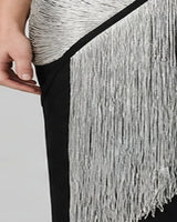 Close-up of long silver fringe panel