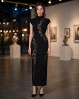 Romy black lace wave bandage maxi dress worn at a gallery opening