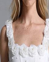 Close-up of fabric rosette trim with pearl centres