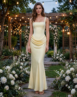 Winona pale yellow satin mermaid maxi dress worn at a garden wedding