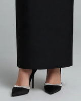 Maxi skirt hem and heels detail